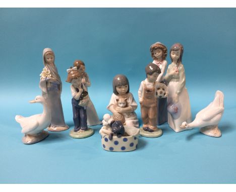 Nine Nao figures and one Lladro figure 