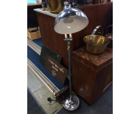 A modern chrome angle poise standard lamp