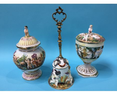 A Capodimonte vase and cover, a hand bell and a cup and cover (3)