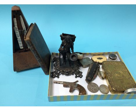 A metronome, World War I tin etc.