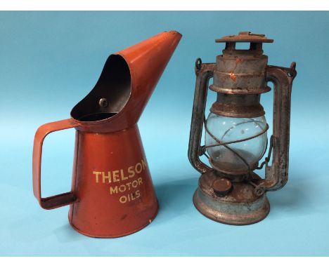 A 'Thelson Motor Oils' oil can and a lamp