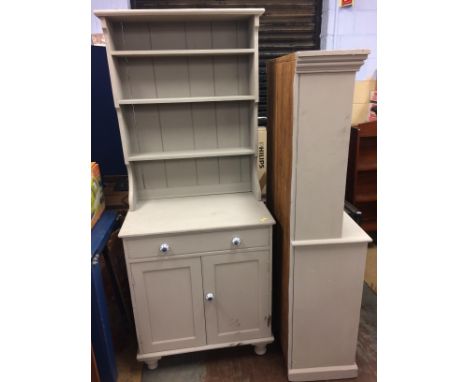 A small grey painted dresser and a kitchen shelf unit