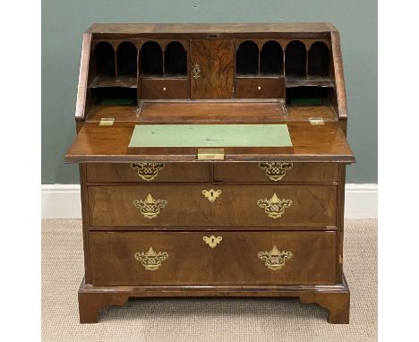 GEORGIAN WALNUT BUREAU with interior well, base with two short over two long drawers, brass drop handles, and on bracket feet