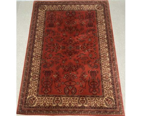 MODERN PERSIAN STYLE WOOLEN RUG, red ground and multi patterned, 242 x 170cmsProvenance: private collection Ynys Môn