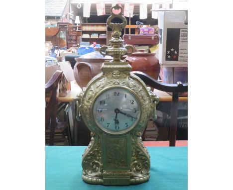 REPOUSSE DECORATED FRENCH STYLE GILT MANTLE CLOCK WITH CIRCULAR DIAL