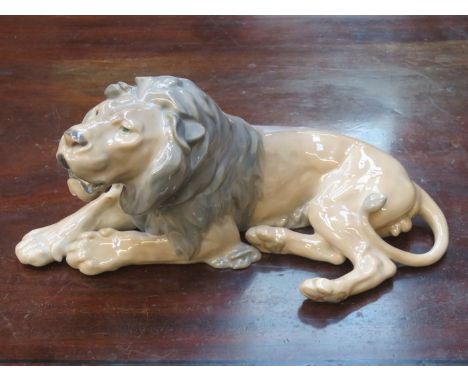ROYAL COPENHAGEN LARGE GLAZED CERAMIC FIGURE OF A RECUMBENT LION BY LAURITZ JENSON 