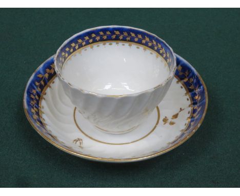 EARLY GILDED AND WAVE EDGED CERAMIC TEA BOWL AND SAUCER 