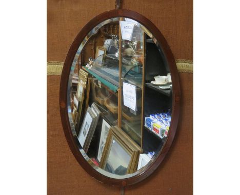 MAHOGANY INLAID AND BEVELLED OVAL WALL MIRROR