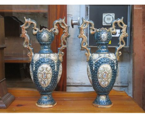 PAIR OF CONTINENTAL CERAMIC TWO HANDLED VASES WITH GILDED DECORATION, APPROXIMATELY 39cm HIGH 