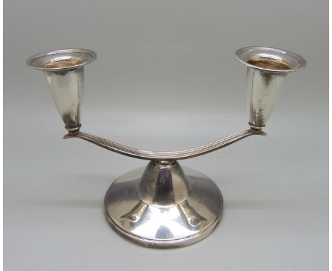 A silver two branch candelabra, Birmingham 1958, Adie Bros., 10.5cm tall 