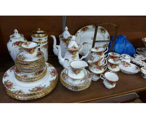 A large collection of Royal Albert Old Country Roses, including five tea cups, seven coffee cups, two pots, a cafetiere, six 