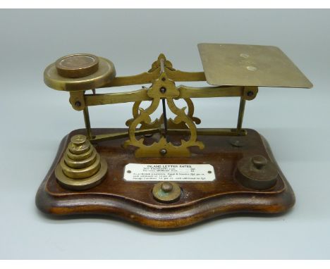 Victorian postal scales, circa 1880 with brass weights and ivorine label listing postal costs