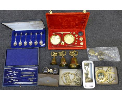 A cased set of balance scales, two other scales, a cased drawing set, a pair of opera glasses marked Paris, cased, a cased se