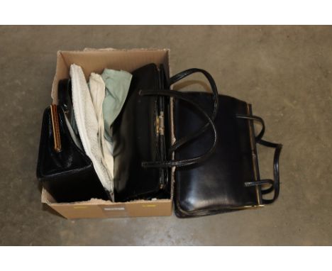 A box of various vintage handbags