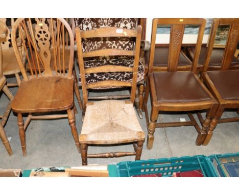 A rust seated ladder back nursing chair