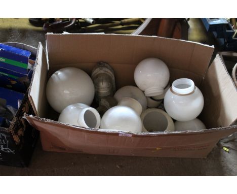 A quantity of opaque glass lamp shades and various other light fittings