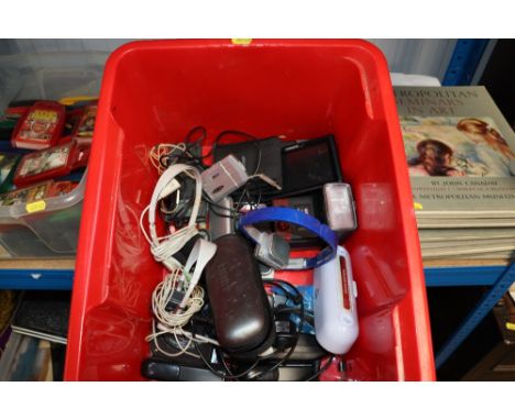A box containing various mobile phones; portable speaker; headphones; Garmin satnav etc