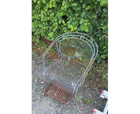 A metal garden armchair; a metal plant pot stand and a fore grate 