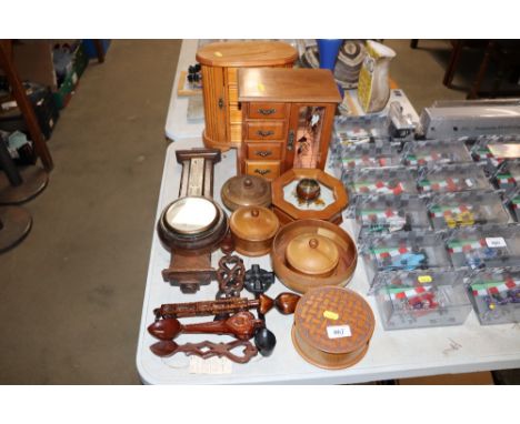 A collection of wooden items to include jewellery chests, Welsh love spoons, barometer etc