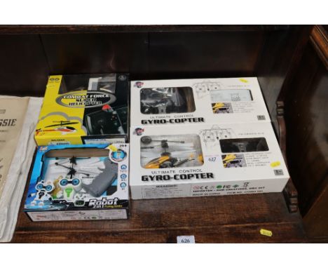 Two boxed Ultimate Controlled gyrocopters; a boxed Combat Force Super Helicopter and a boxed Flying Robot 