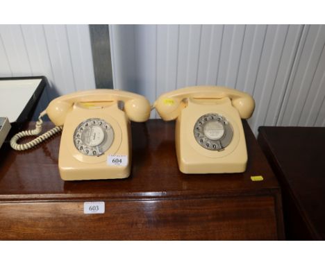 Two rotary dial telephones