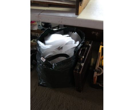 A quantity of bubble wrap bags and a briefcase