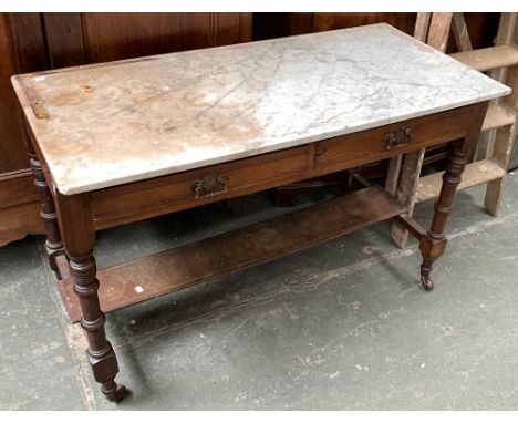 A late 19th century marble topped wash stand, with two frieze drawers, block turned legs joined by undershelf, on ceramic cas