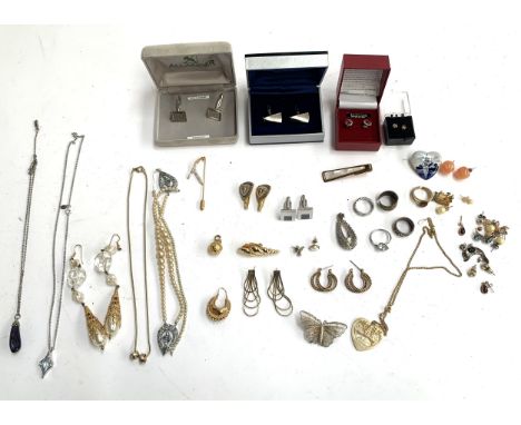 A mixed lot of jewellery to include a pair of boxed Swarovski crystal and synthetic ruby stud earrings, a pair of sterling si
