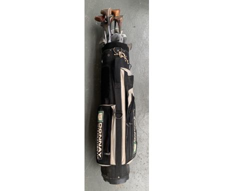 A Donnay golf bag containing a quantity of clubs, to include Dunlop, Regency, Harry Busson etc 