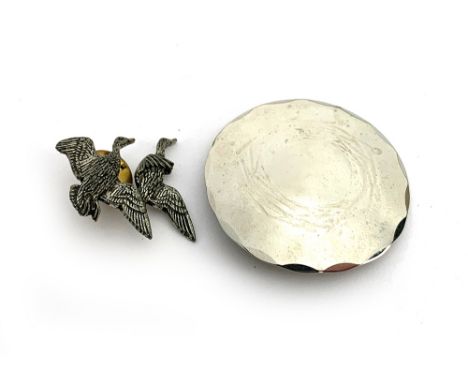 A pewter brooch of ducks in flight by A R Brown, 3cm wide; together with a Lakeland Art Metal brooch, 4.5cmD (2) 