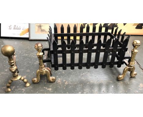 A pair of brass fire dogs, together with a cast iron fire grate and one other fire dog 