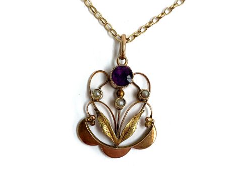 An Art Nouveau 9ct gold pendant set with an amethyst and three seed pearls, hallmarked H&amp;W, 2.5cm long, on a 9ct gold cha