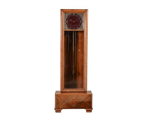 A German walnut Art Deco style quarter chiming longcase clock, the mock red marble dial with cut-away silvered frame, glazed 