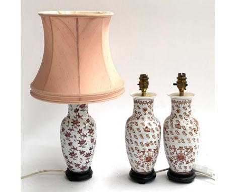 A pair of baluster form ceramic table lamps, together with one other similar with shade, height to top of shade 55cm 