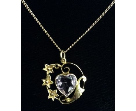 An Edwardian style amethyst pendant, open scrolling floral mount, central pale purple heart shaped amethyst, stamped 9ct, sus