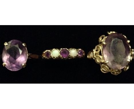 A five stone opal and amethyst ring, alternate set with three graduating amethysts and two opals, 9ct gold shank;  a large am