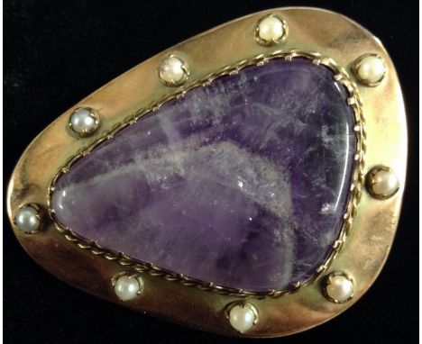 An early 20th century veined amethyst and seed pearl brooch, free from triangular amethyst panel, surrounded by a 9ct rose go