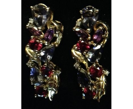 A pair of multi-stone diamond, amethyst, garnet and other stone pendants, each leafy branch body set with eleven navette, rou