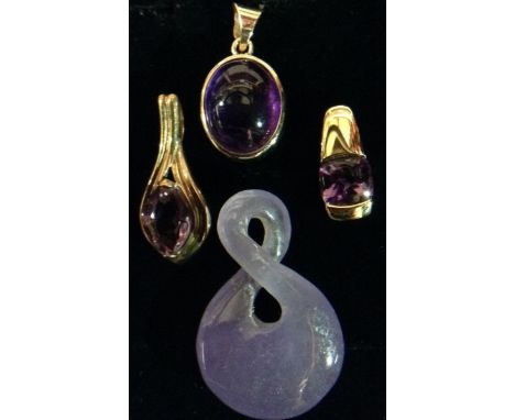 An oval cabochon amethyst pendant, 9ct gold collar mount;  others navette, rounded square, figure of eight, three with 9ct go