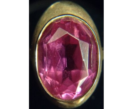 A Russian pink tourmaline dress ring, oval faceted pink tourmaline, out swept collar, 14ct rose gold shank, size O, 5.9g gros