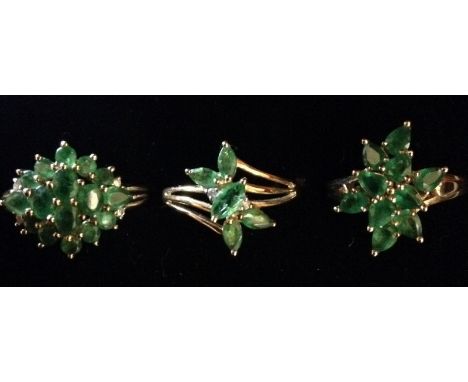 Rings - an emerald cluster ring, free form stepped floral cluster od ten pendeloque emeralds, 9ct gold shank, size N;  anothe