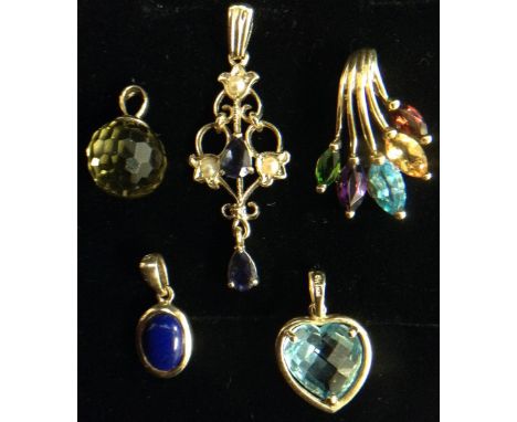 A garnet, citrine, topaz, amethyst and peridot five prong pendant, each different length prong terminating with a different m