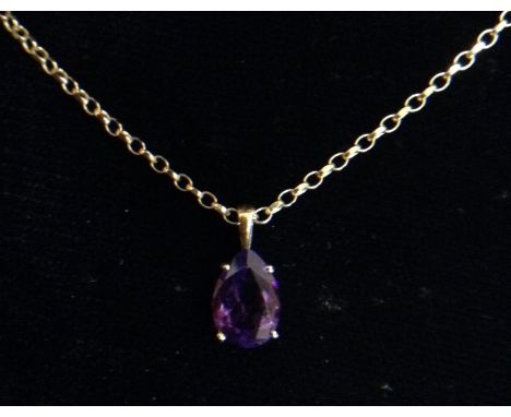 An amethyst pendant necklace, single stone teardrop amethyst, 9ct gold mount and curb link chain, 37cm long, 3g gross