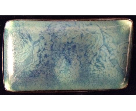 A Ruskin pottery rectangular panel brooch, mottled tones of turquoise and blue, impressed marks, white metal mount and pin, 4