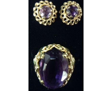 An amethyst dress ring, central oval amethyst raised upon an open cast floral crown mount, 9ct gold shank, size N;  a pair of