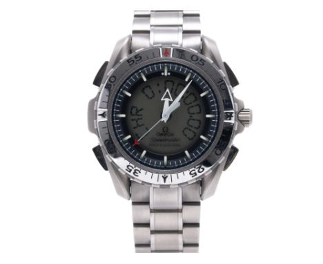 The case is titanium, 42mm in size, with four pushers and a crown and rotating bezel. The dial has a black chapter ring with 