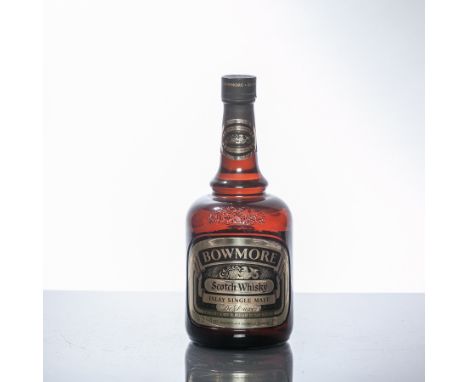 BOWMORE DE LUXE 
Islay Single Malt Scotch Whisky in brown dumpy bottle. 26 2/3 fl. ozs, 70° proof. 