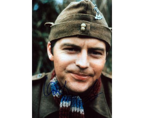 Ian Lavender signed 12x8 inch Dads Army colour photo. Good condition. All autographs are genuine hand signed and come with a 