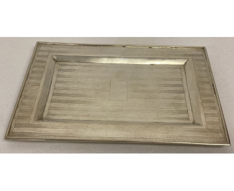 An early 20th century, Tuck Chang Shanghai silver rectangular shaped shallow coin/calling card tray.  With engine turned deta