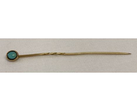 A vintage 9ct gold stick pin set with a round turquoise cabochon.  Tests as 9ct gold.  Total weight approx. 1.2g.